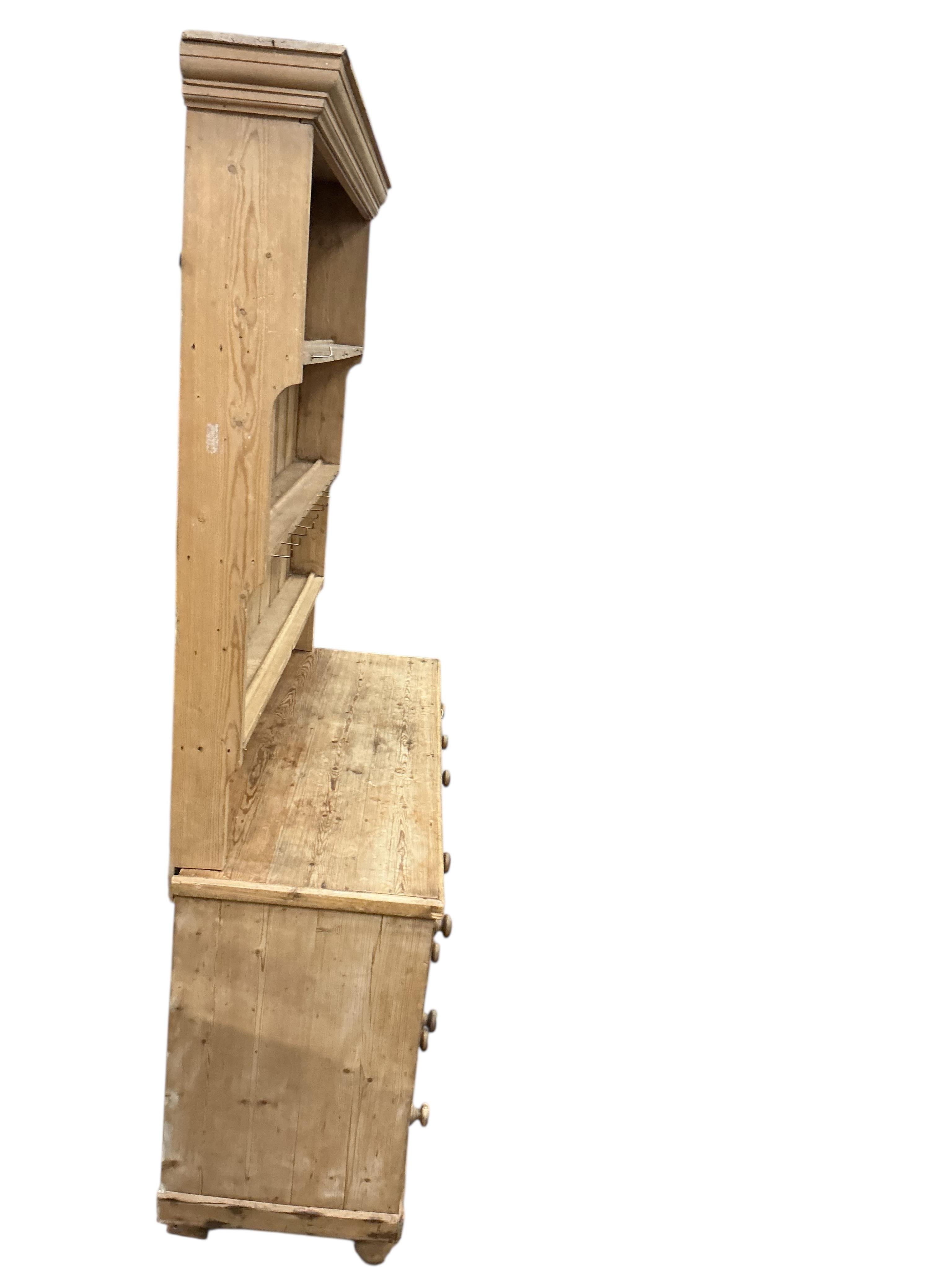 A Victorian pine dresser with boarded rack, width 148cm, depth 48cm, height 224cm